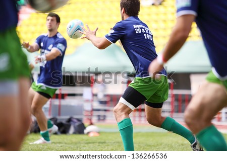 MOSCOW - JUNE 30: Rugby players from Portugal relocate ball on second stage of European championship on rugby-7 in sports complex Luzhniki, on June 30, 2012 in Moscow, Russia.