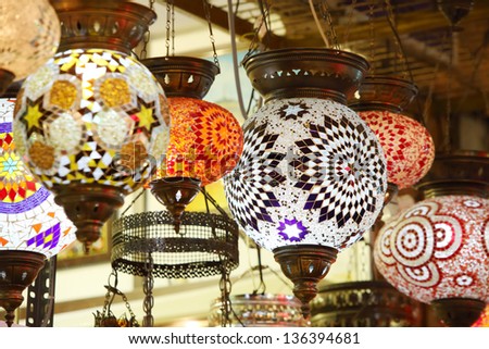 Beautiful lights hanging in tent of merchant in Central Asian market.