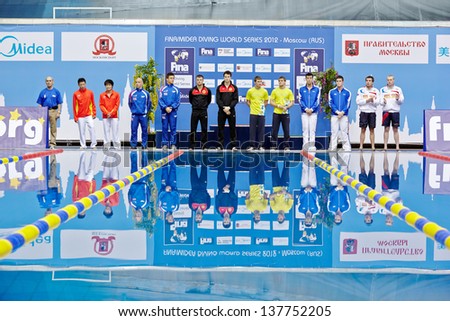 MOSCOW - APR 13: Athletes stand near to victory podium before awarding at Pool of SC Olympic on day of third phase of the World Series of FINA Diving, April 13, 2012, Moscow, Russia.