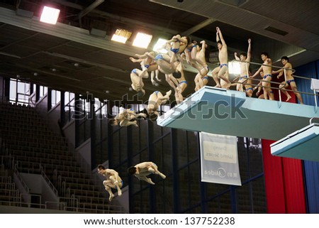 MOSCOW - APR 13: (Serial shots) Athletes jump from diving-tower in Pool of SC Olympic on day of third phase of World Series of FINA Diving, April 13, 2012, Moscow, Russia.