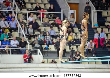 MOSCOW - APR 13:  Female athletes ready for jump during competitions on springboard diving in Pool of SC Olympic on day of third phase of the World Series of FINA Diving, April 13 2012, Moscow Russia.