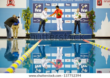 MOSCOW - APR 13: Athletes of Russia and China stand on victory podium during awarding at Pool of SC Olympic on day of third phase of the World Series of FINA Diving, April 13, 2012, Moscow, Russia.