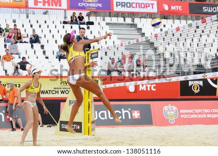 MOSCOW - JUNE 6: Two athletes from Brazil play volleyball in Country Quota at tournament Grand Slam of beach volleyball 2012, on June 6, 2012 in Moscow, Russia.