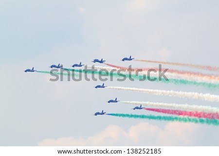 ZHUKOVSKY - AUGUST 12: Military italian aircrafts let smoke of colors of Italian flag at airshow devoted to 100 anniversary of Russian Air Forces, August 12, 2012 in Zhukovsky, Moscow region, Russia.