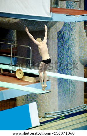 MOSCOW - APR 13: Athlete performs jump from springboard at Pool of SC Olympic on day of third phase of the World Series of FINA Diving, April 13, 2012, Moscow, Russia.