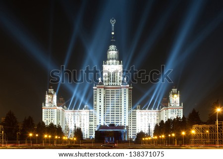 MOSCOW - AUG 28: Evening view of Moscow State University with large number of projectors, Aug 28 2011, Moscow Russia. Central building of university complex of Moscow State University on Sparrow Hills