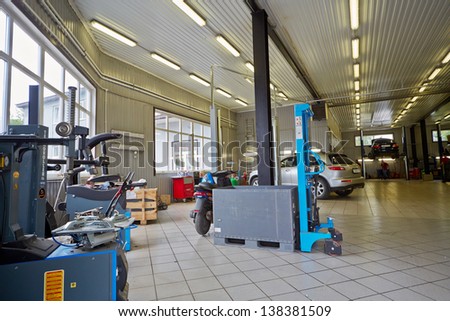MOSCOW - MAY 30: Cars and equipment in workshop of service station Union Motors, May 30, 2012, Moscow, Russia. Union Motors is a specialized center in repairing Nissan cars.