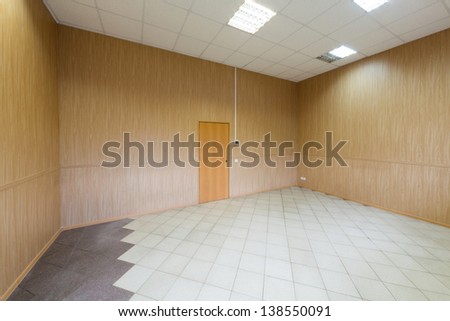 Large bright empty room with one door