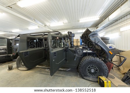 MOSCOW - SEP 21: Large military car is in the repair on car repair shop Avtostandart on September 21, 2012 in Moscow, Russia.