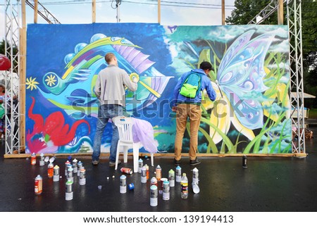 MOSCOW - AUGUST 18: Participants of festival graffiti at festival Bright people in Gorky Park, on August 18, 2012 in Moscow, Russia.