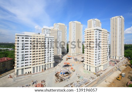 MOSCOW - AUG 6: High buildings of residential complex Elk Island under construction, on August 6, 2012 in Moscow, Russia. Residential complex Elk Island comprises seven buildings of 12 to 29 stories.