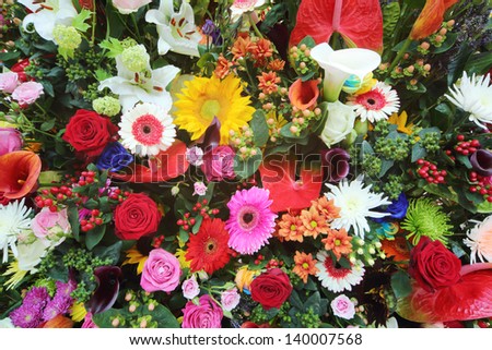 Colorful flowers in large bouquet of callas, lilies, roses, gerberas.