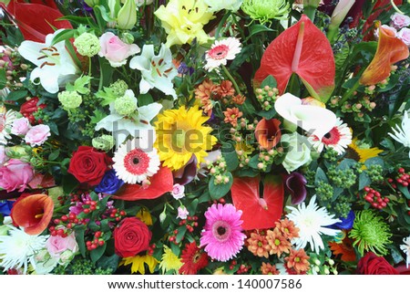 Beautiful bright flowers in large bouquet of callas, lilies, roses, gerberas.