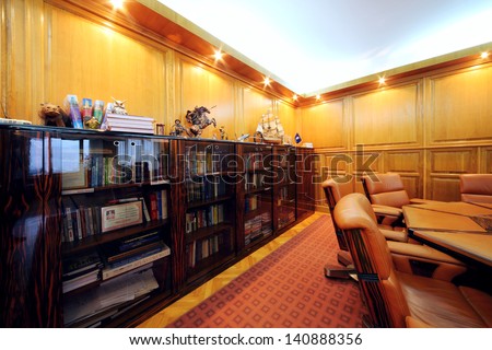 MOSCOW - AUG 15: Bookcase in office of company RUSELPROM, Aug 15, 2012 in Moscow, Russia. RUSELPROM Group comprises 12 companies and affiliated companies, producing electric motors, generators.