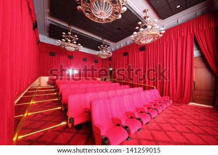 MOSCOW - SEPTEMBER 4: Big hall with red curtains in cinema in GUM, on September 4, 2012 in Moscow, Russia. Comfortable big hall of cinema in GUM has 70 seats.