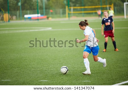 MOSCOW - AUG 23: Forward of CSP Izmailovo (Moscow) dribbles ball in game against team Mordovochka (Saransk) at stadium of sports complex CSP Izmailovo, August 23, 2012, Moscow, Russia.