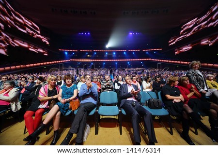 MOSCOW - OCTOBER 14: Audience claps at anniversary concert of Edyta Piecha in Kremlin Palace, on October 14, 2012 in Moscow, Russia.