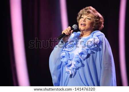 MOSCOW - OCTOBER 14: Edyta Piecha in blue dress sings at her anniversary concert in Kremlin Palace, on October 14, 2012 in Moscow, Russia. Famous Russian singer Edita Piecha is 75 years.