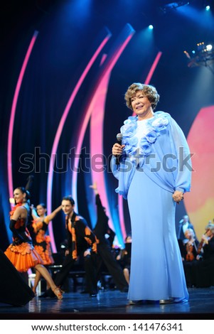 MOSCOW - OCTOBER 14: Smiling Edyta Piecha and dancers at her anniversary concert in Kremlin Palace, on October 14, 2012 in Moscow, Russia. Famous Russian singer Edita Piecha is 75 years.