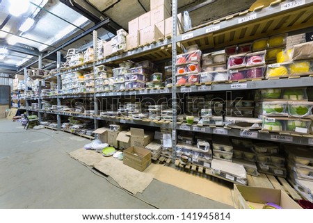 MOSCOW - NOV 16: Warehouse on Baikal street with shelves full of varicolored flowerpot on November 16, 2012 in Moscow, Russia.