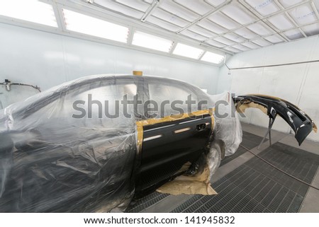 MOSCOW - SEP 21: Car door and bumper after painting on body shop Avtostandart on September 21, 2012 in Moscow, Russia.