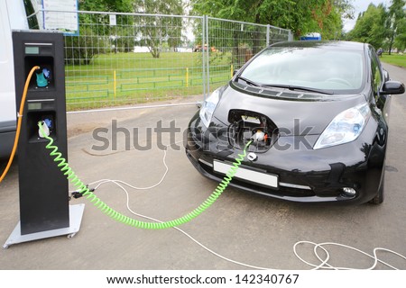MOSCOW - AUGUST 18: Modern electric car recharged at electrical charging at festival Ekofest 2012 on banks of Stroginsky gulf, on August 18, 2012 in Moscow, Russia.