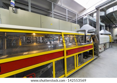 MOSCOW - OCT 16: Packaging machine in brewery Ochakovo on October 16, 2012 in Moscow, Russia. Ochakovo is largest Russian company beer and soft drinks industry without foreign capital