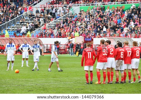 MOSCOW - SEP 9: Preparing for free kick at football match Spartak Moscow (in red) - Dynamo Kiev (in white) at Lokomotiv stadium (Farewell match of Yegor Titov), on September 9, 2012 in Moscow, Russia.