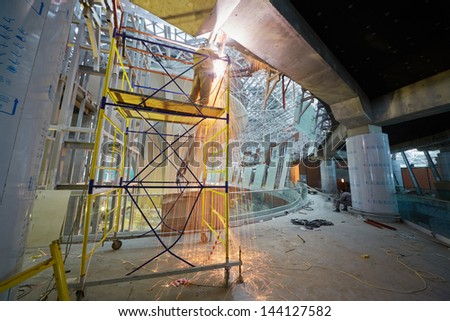 MOSCOW - NOV 29: Welding works on second floor at construction of terminal at Domodedovo Airport, November 29, 2012, Moscow, Russia. Terminal A has area of 96 thousand sq.m.