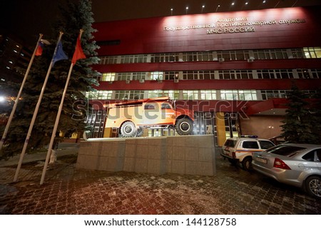 MOSCOW - NOV 27: Fire-engine on pedestal in front of building of Academy of State Fire Service Emergency of Russia, November 27, 2012, Moscow, Russia.
