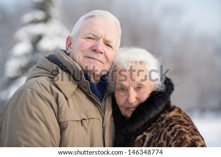 Gentle portrait of an elderly couple in winter
