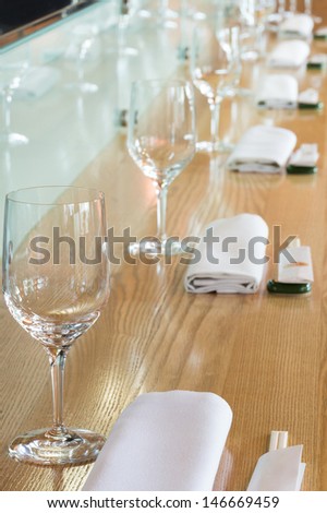 Glasses in the table at cozy cafe with modern interior.