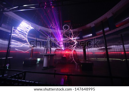 MOSCOW - FEBRUARY 8: Man in special suit at presentation of attraction Megavolt - master of lightning at VVC, on February 8, 2013 in Moscow, Russia.