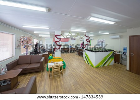 MOSCOW - DEC 10: Large office with sofas for relaxation and layout of buildings in NDV Company on December 19, 2012 in Moscow, Russia.