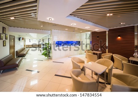 Beautiful Large Reception Of Business Company With Tables, Chairs And Aquarium.