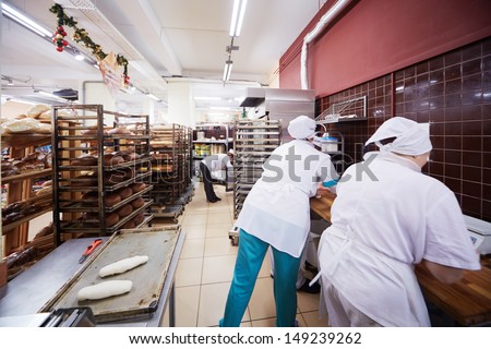 MOSCOW - DEC 8: Women work in bakery of supermarket of home food Bahetle, December 8, 2012, Moscow, Russia. Currently company Bahetle has 25 stores.