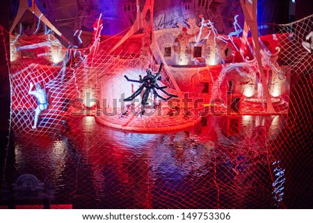 MOSCOW - JAN 5: Actor-spider on cobweb during musical show for children Through the Looking Glass in Swimming Pool of Sports complex Olympyisky, January 5, 2013, Moscow, Russia.