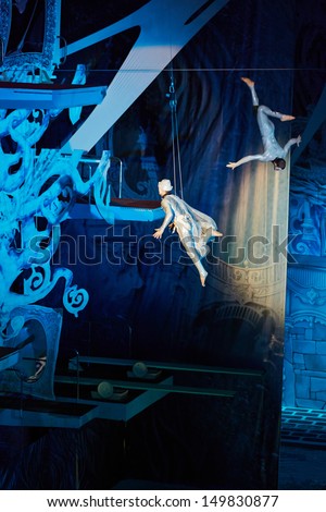 MOSCOW - JAN 5: Male air gymnasts in New Year performance for children Through the Looking Glass in Swimming Pool of Sports complex Olympyisky during school holidays, January 5, 2013, Moscow, Russia.