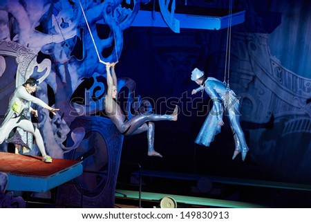 MOSCOW - JAN 5: Air gymnasts perform in fancy musical show for children Through the Looking Glass in Swimming Pool of Sports complex Olympyisky during school holidays, January 5, 2013, Moscow, Russia.