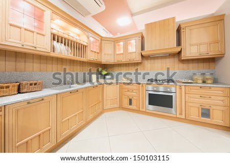 Kitchen Interior Designed In Beige Color And Decorated In Wood In Furniture Salon