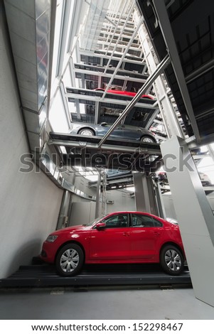MOSCOW - JAN 11: Cars on platforms located one above the other in the transparent tower for storage in Varshavka Center on January 11, 2013, Moscow, Russia. The tower was designed and built in 2009