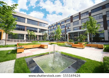 Park with fountains and benches in front of the Business Center
