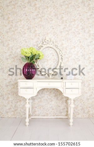 Beautiful Wooden Carved Dressing Table With Blank Frame In Light Room.