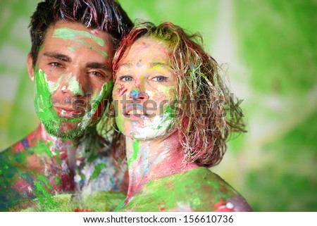Portrait of man and girl in studio with whole body in the paint