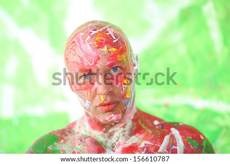 Whole painted bald man with a thoughtful face