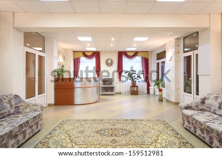 Light hallway with sofas and reception area in a holiday home