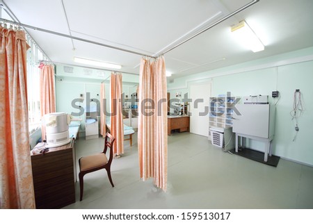 Cabinet for procedures with beds and appliances, room is separated by curtains