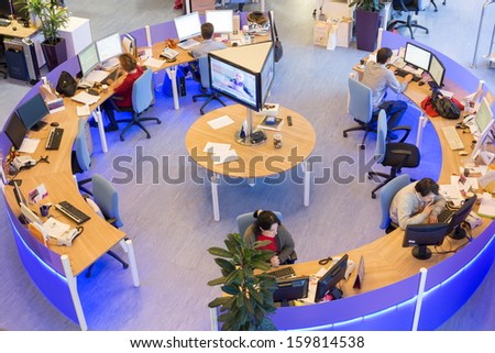 MOSCOW - MAR 5: Office room news agency RIA Novosti with tables around with blue light on March 5, 2013 in Moscow, Russia.