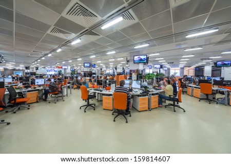 Moscow - Mar 5: Employees Work In Office Buildings News Agency Ria Novosti With Orange Furniture And Many Screens On March 5, 2013 In Moscow, Russia.