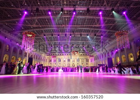 MOSCOW - MAY 25: Beautiful people under purple lights at 11th Viennese Ball in Gostiny Dvor on May 25, 2013 in Moscow, Russia.